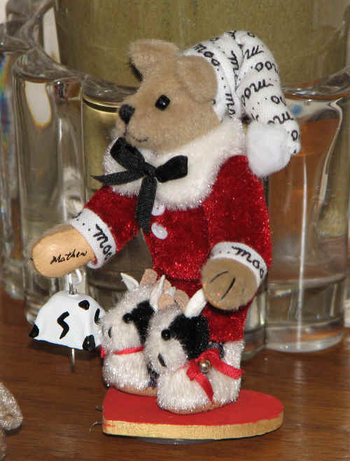 A 2 3/4 inch Santa Bear in bunny slippers