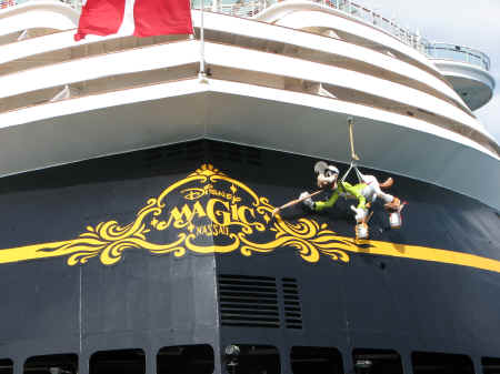 Goofy painting the stern of the Disney Magic