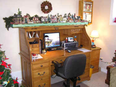 Gary's desk with a Dickens Christmas Village on top