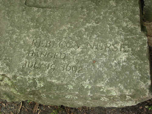 The inscription beside where Carol is sitting.